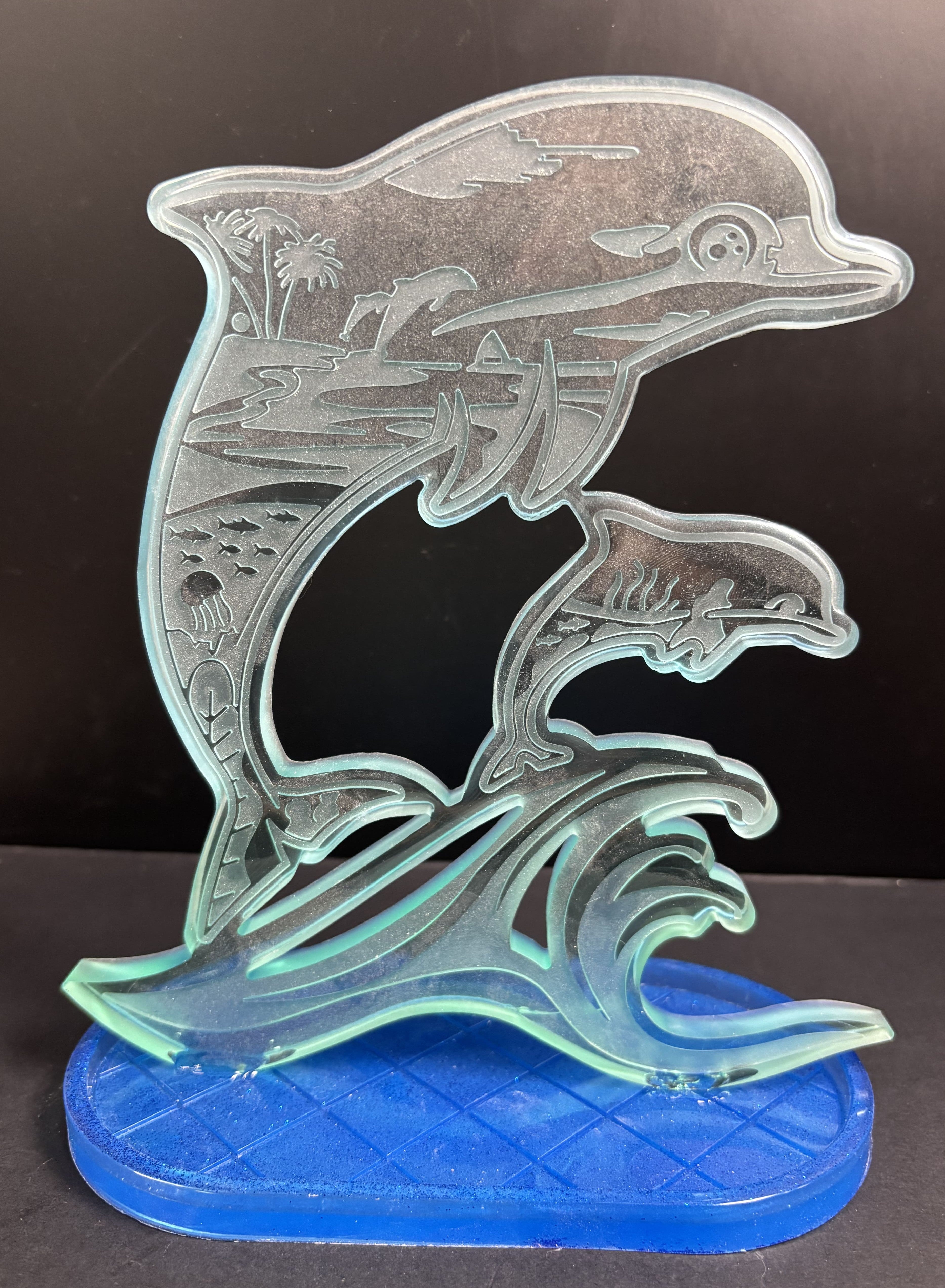 Support double dauphins sur socle bleu ovale